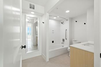 Large bathroom with full-length mirror